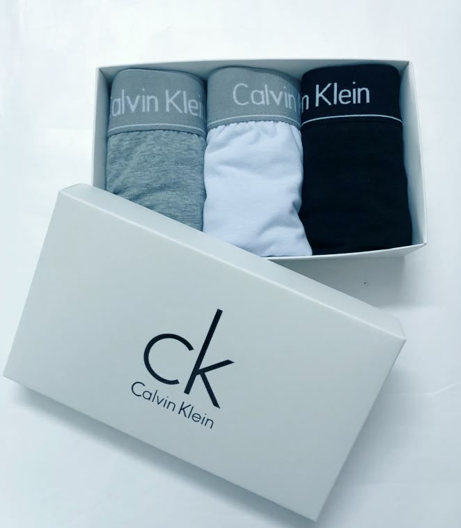 Male model wearing underwear and using a phone